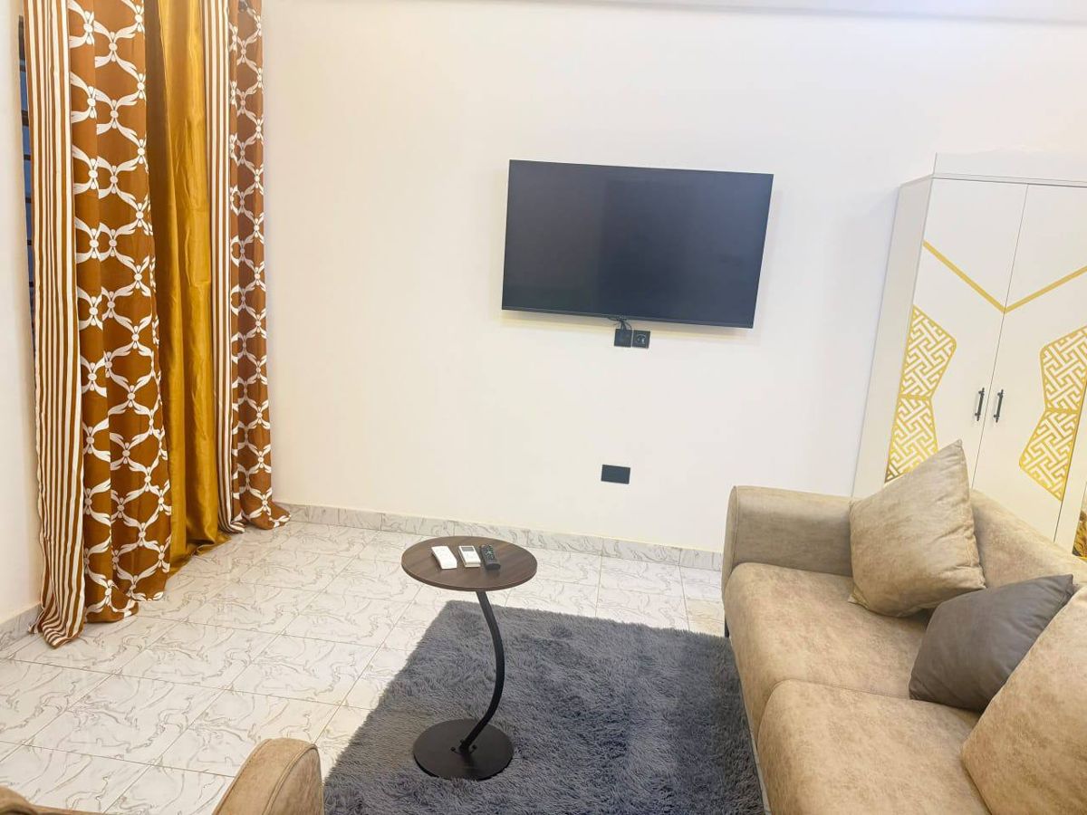 Lounge with wall-mounted TV