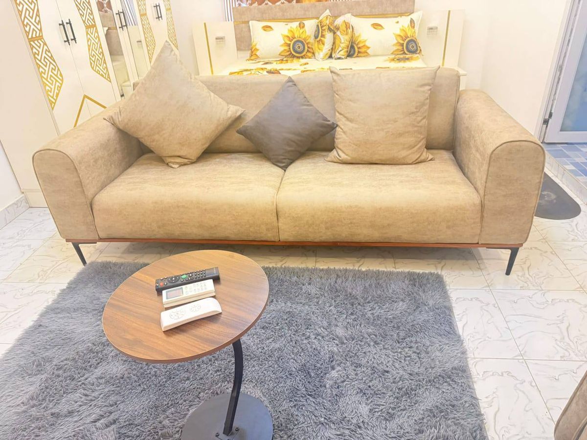 Sofa with cushions and side table